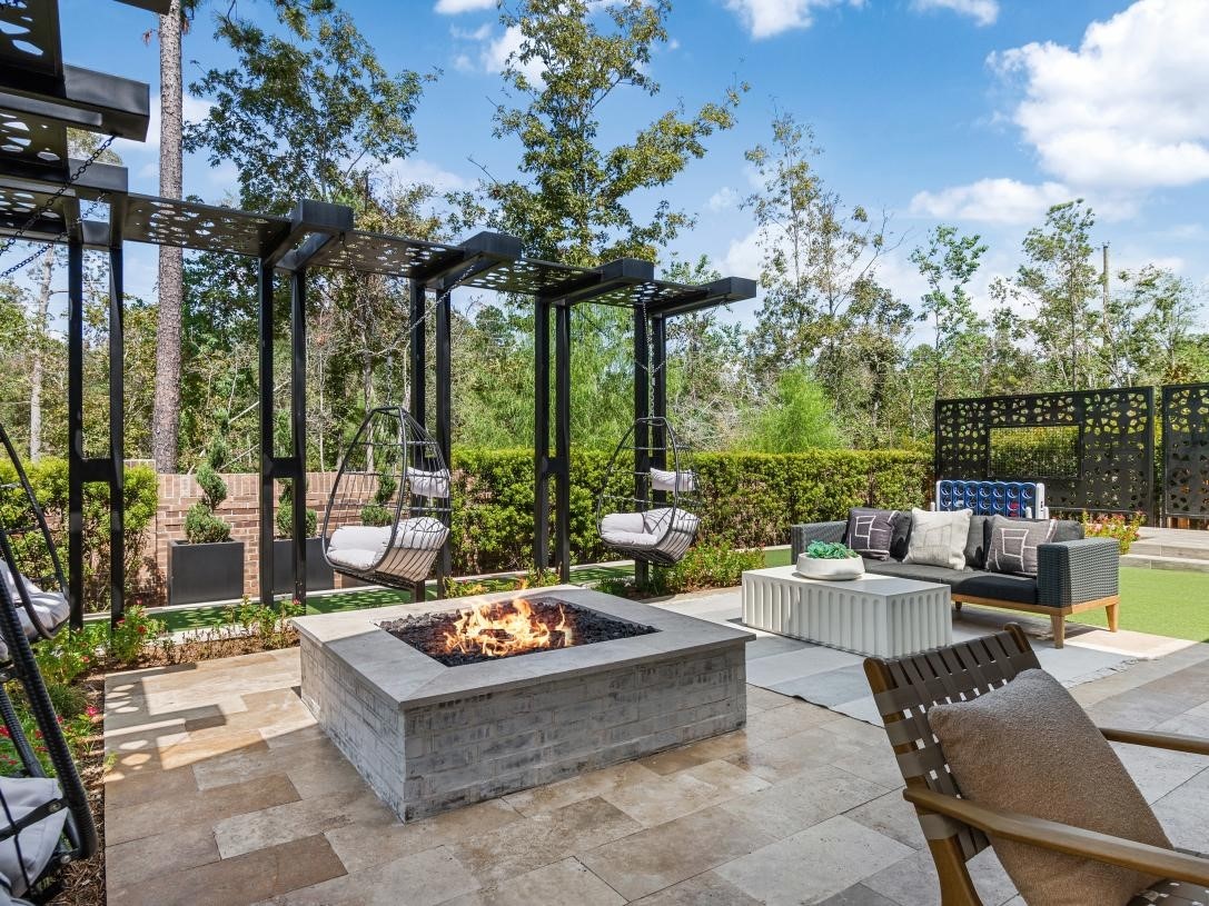 4740 Cascade Rdg Drive Spring, TX 77386 - Photo 11 of 11 a view of a patio with couches potted plants and a table and chairs