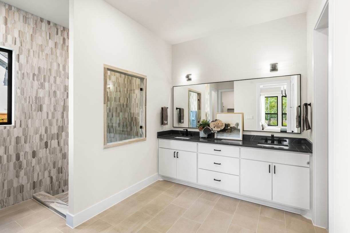 4740 Cascade Rdg Drive Spring, TX 77386 - Photo 7 of 11 a bathroom with double sink and a mirror