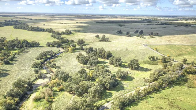a view of an ocean and a mountain