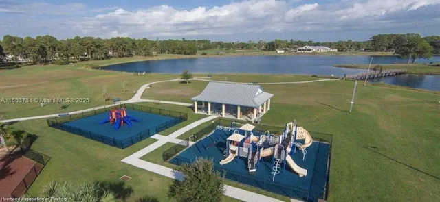 an aerial view of a house with a lake view