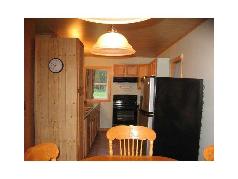 1077 Roxbury Notch Road Roxbury, ME 04275 - Photo 11 of 21 Dining Room. dining to kitchen
