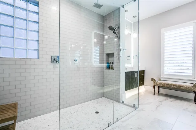 a bathroom with a bathtub and a shower
