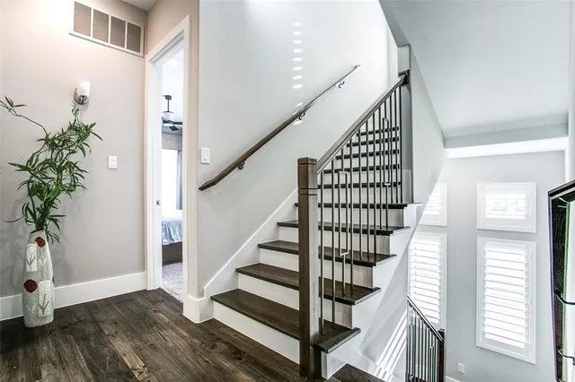a view of entryway with wooden floor and stairs
