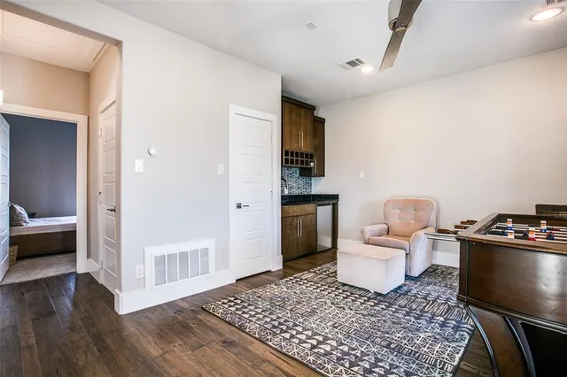 a living room with furniture and a rug