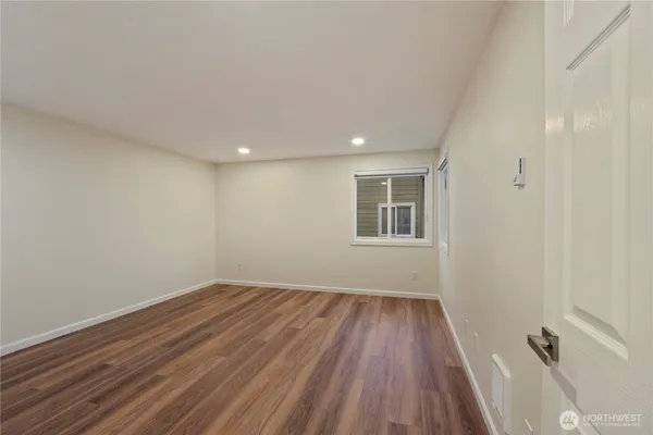a view of a room with wooden floors and led lights