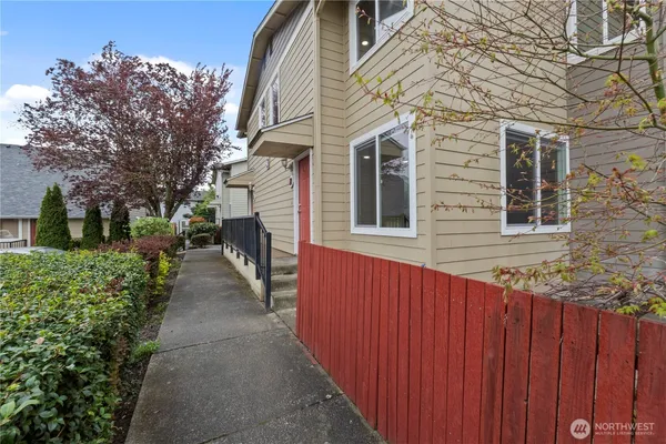 a view of a pathway with a house in the background
