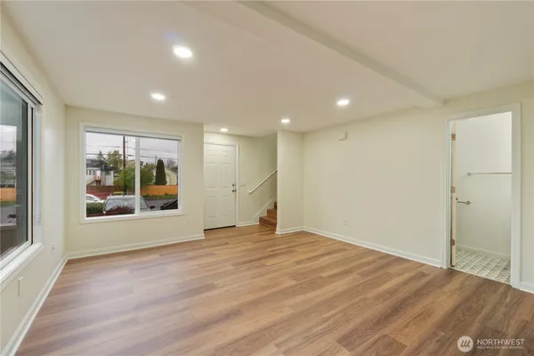 a view of an empty room with a window