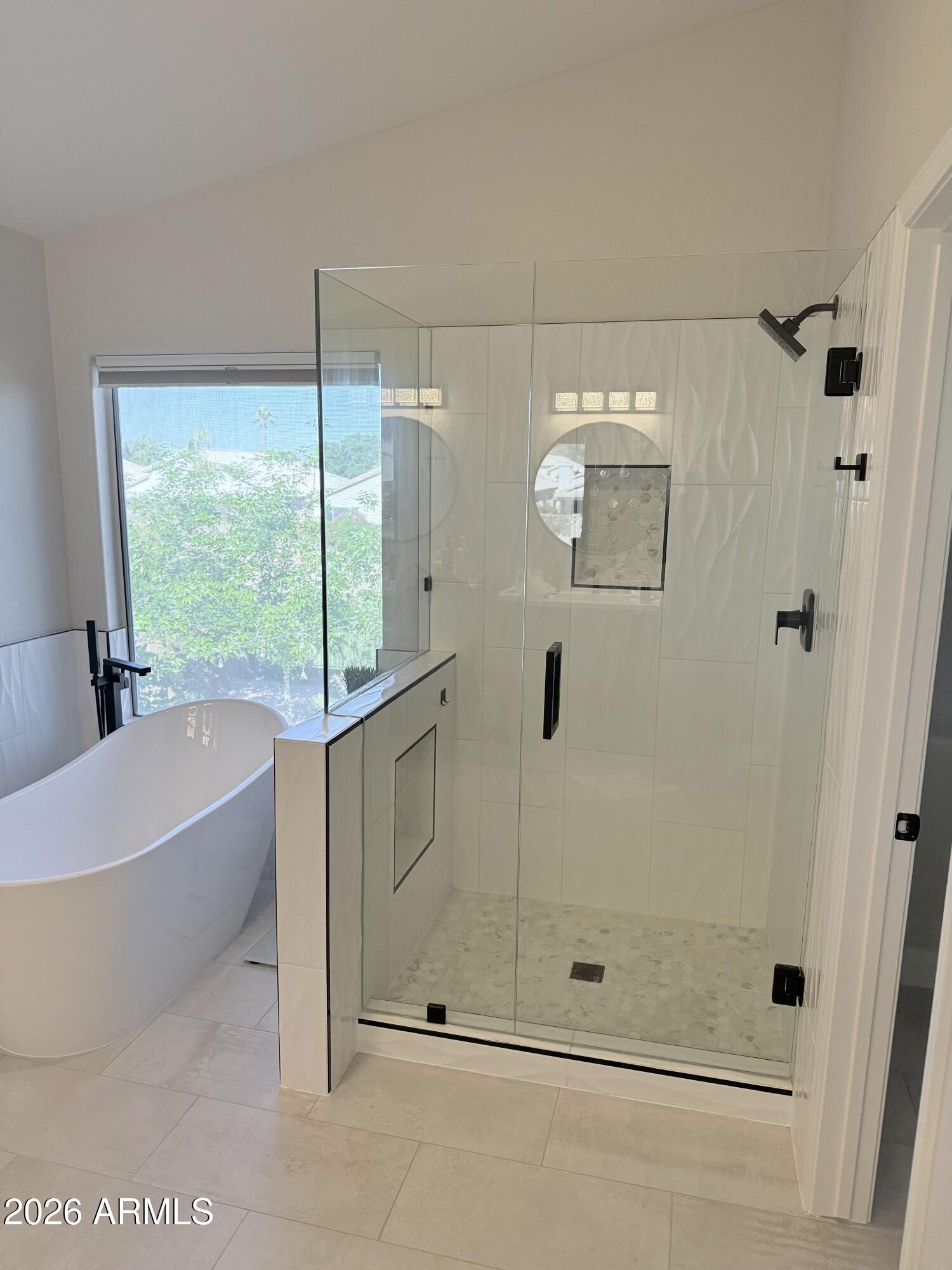 3426 East Clark Road Phoenix, AZ 85050 - Photo 26 of 48 a bathroom with a bathtub and a shower