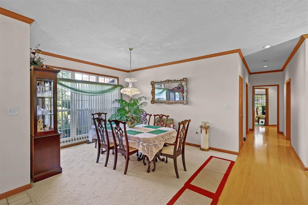 1150 Tyler Road Lexington, TN 38351 - Photo 3 of 24 a view of a dining room with furniture and a chandelier