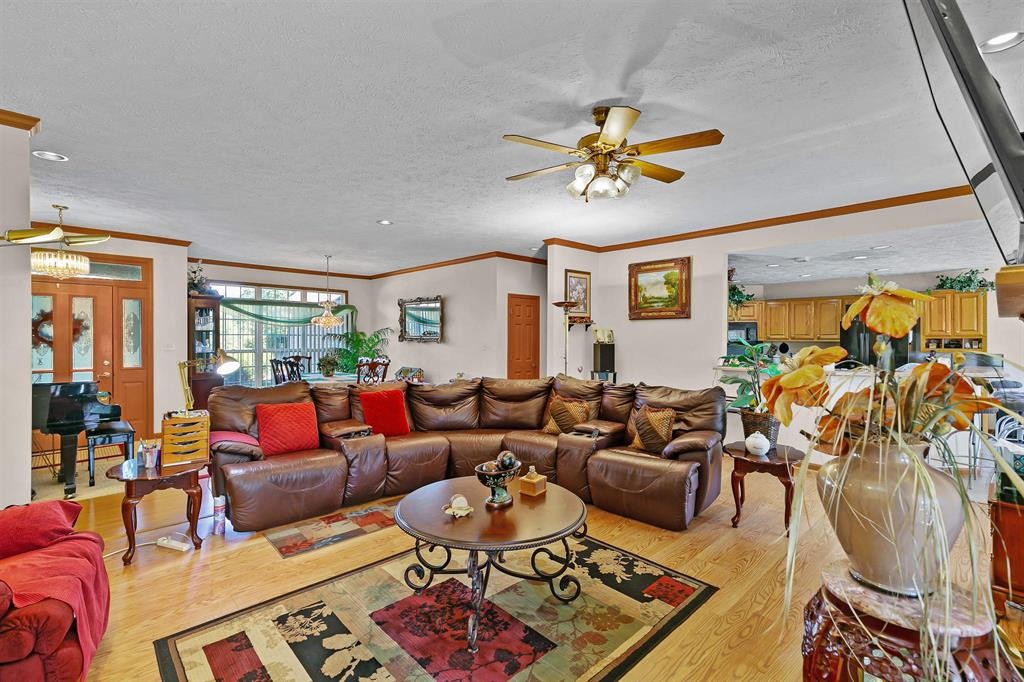 1150 Tyler Road Lexington, TN 38351 - Photo 7 of 24 a living room with furniture ceiling fan and a rug