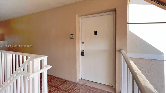 a view of living room with furniture and a window