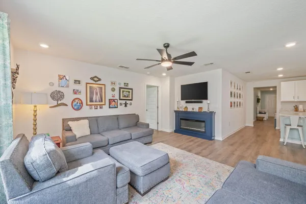 a living room with furniture and a large window