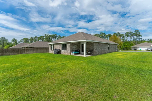 a house that has garden in front of it