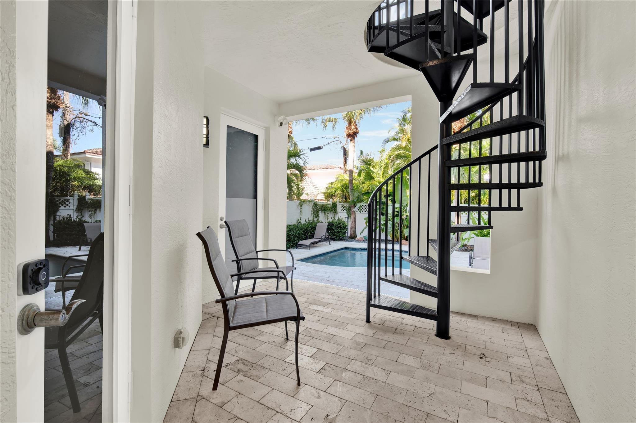 425 North Ocean Boulevard, Unit 3 Boca Raton, FL 33432 - Photo 4 of 69 a view of staircase with white walls and a window