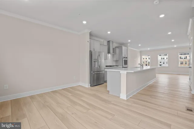 a view of kitchen with wooden floor