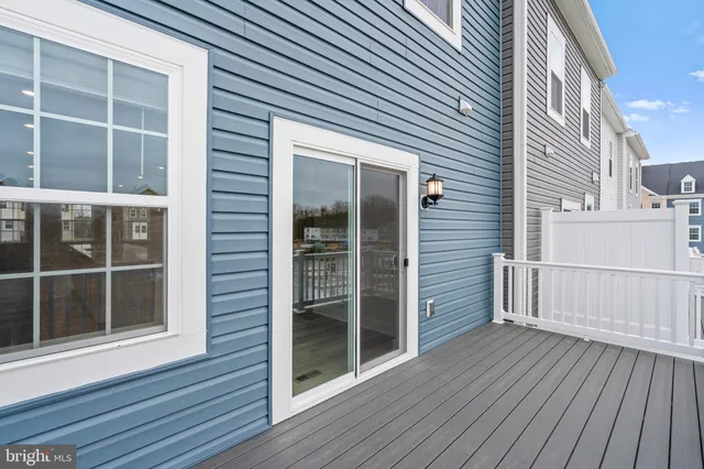 a view of a balcony with wooden floor