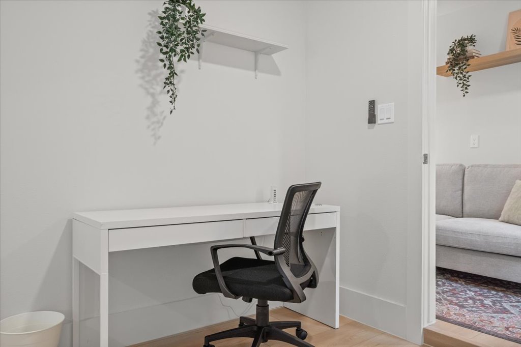 1406 North Georgetown Street Round Rock, TX 78664 - Photo 26 of 34 An inviting office nook offers a calm space for productivity with light wood flooring.