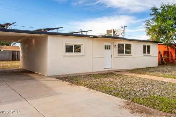 a house with trees in the background