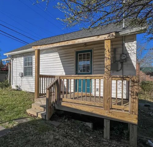 a front view of a house with a deck