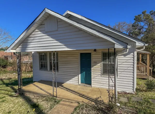 a front view of a house with a porch