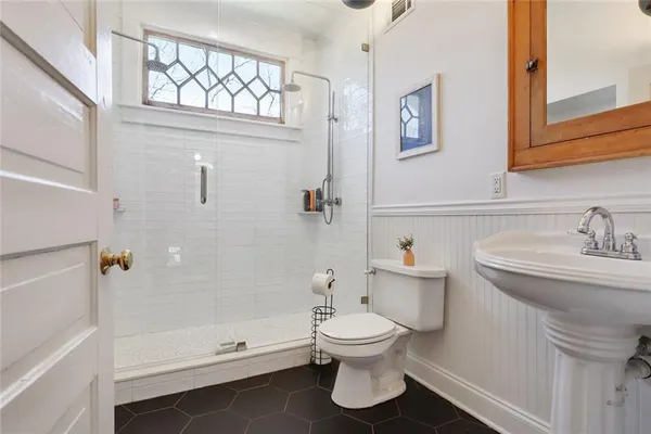 a bathroom with a sink a toilet and a bathtub