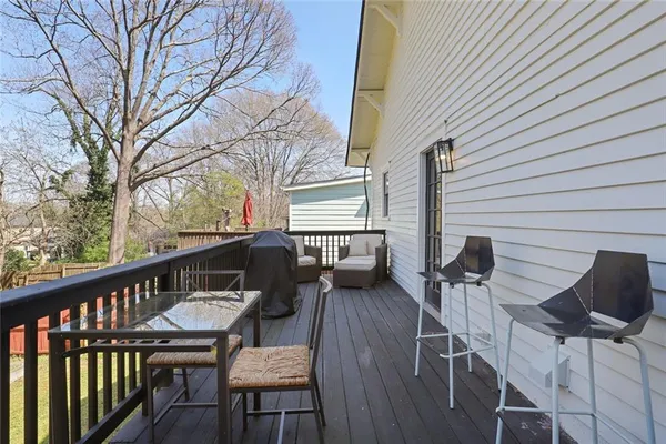 a view of a balcony with chairs