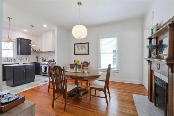 a view of a dining room with furniture and wooden floor