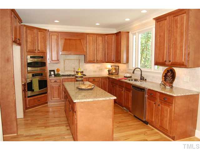 11406 Hickory Grove Church Road Raleigh, NC 27613 - Photo 4 of 12 a kitchen with stainless steel appliances a sink window and cabinets
