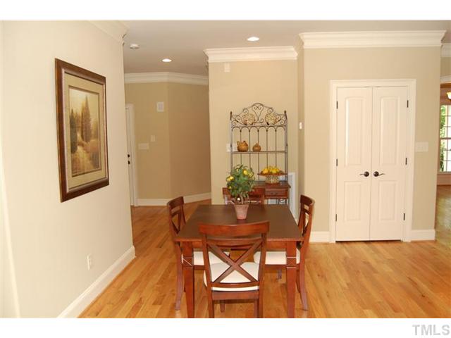 11406 Hickory Grove Church Road Raleigh, NC 27613 - Photo 5 of 12 a view of a dining room with furniture and wooden floor