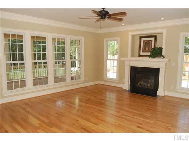 11406 Hickory Grove Church Road Raleigh, NC 27613 - Photo 8 of 12 a view of an empty room with wooden floor and a window