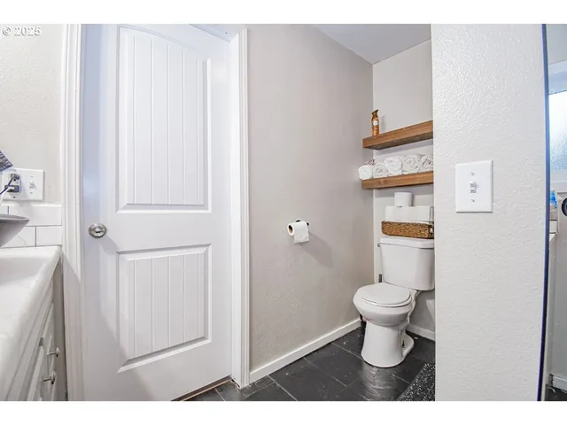 a bathroom with a toilet and a sink