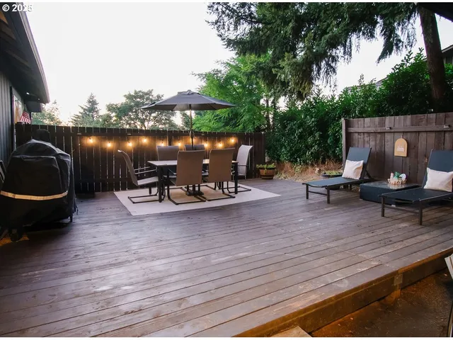a aerial view of a house with a yard basket ball court and outdoor seating