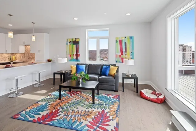 a living room with furniture and a table