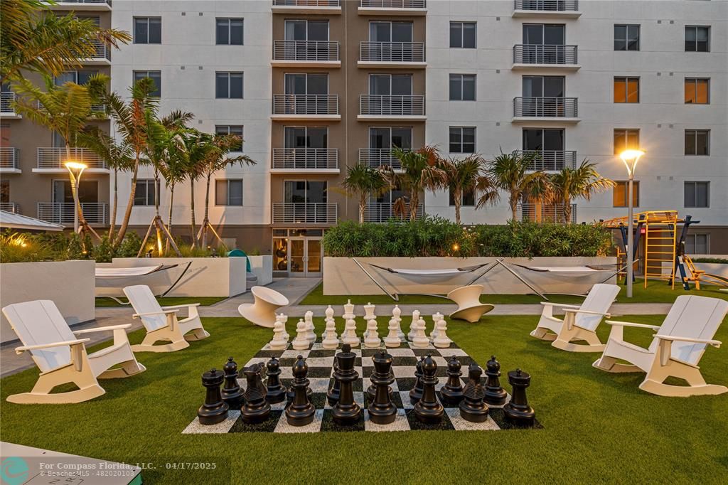 200 Northeast 1st Avenue, Unit 105 Pompano Beach, FL 33060 - Photo 17 of 20 a front view of a building with outdoor seating