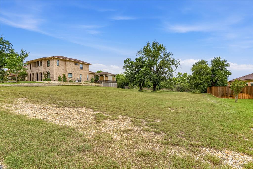 4512 Blue Ridge Drive Belton, TX 76513 - Photo 10 of 12 a view of a large garden with large trees