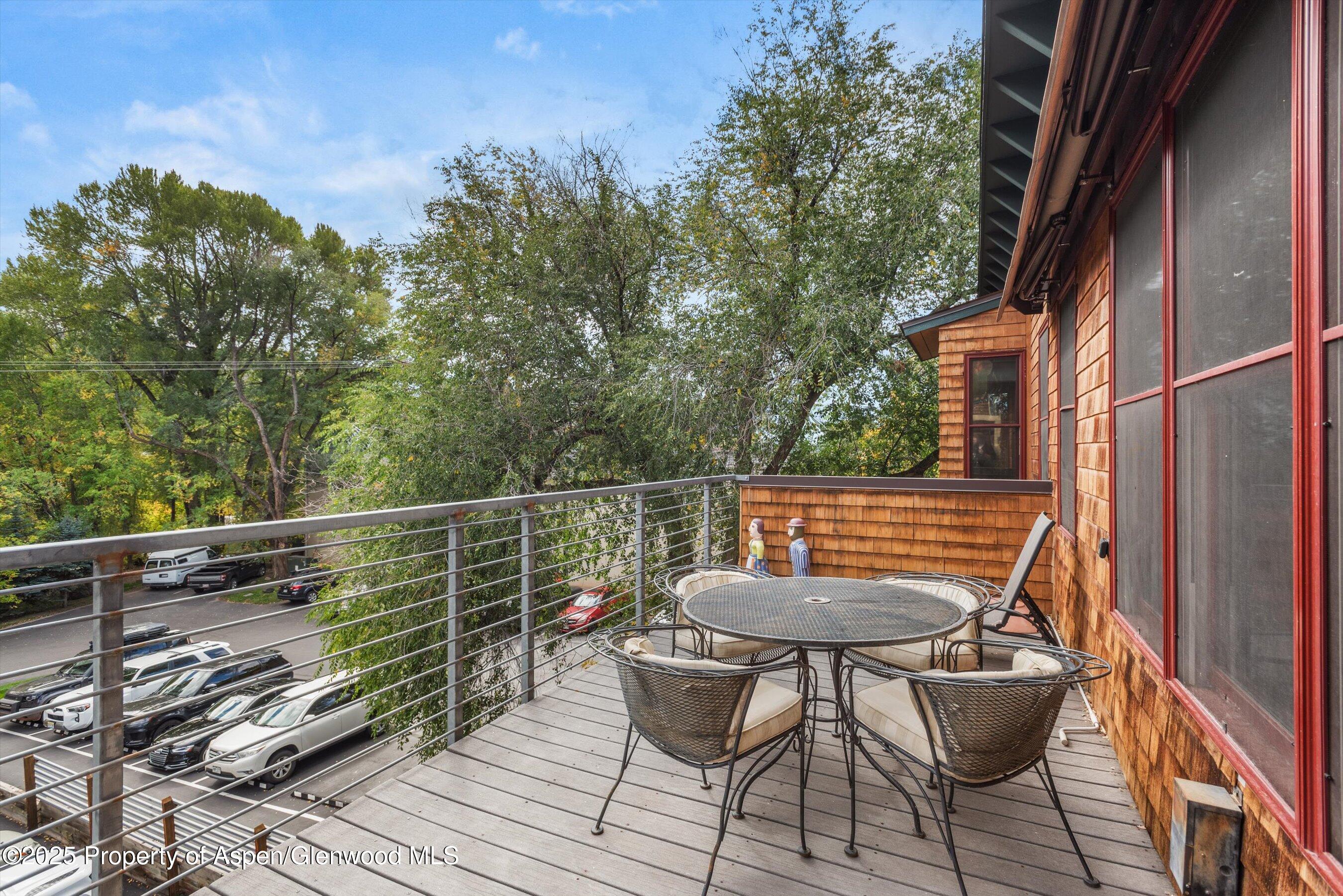 227 Midland Avenue, Unit 22 Basalt, CO 81621 - Photo 17 of 42 a balcony with table and chairs