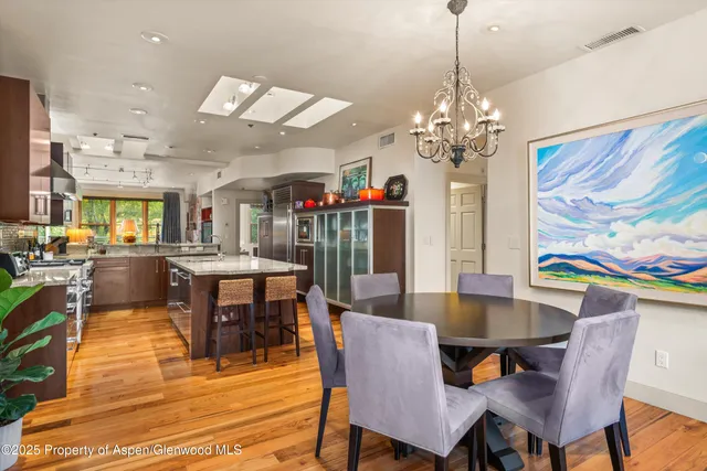 a living room with furniture fireplace and flat screen tv