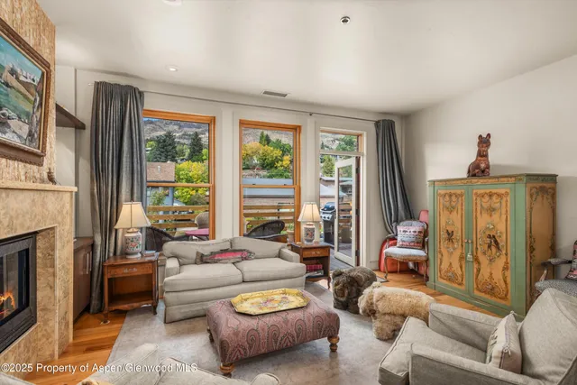a living room with furniture and a fireplace