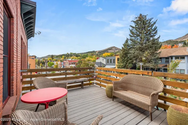 a front view of a house with outdoor seating