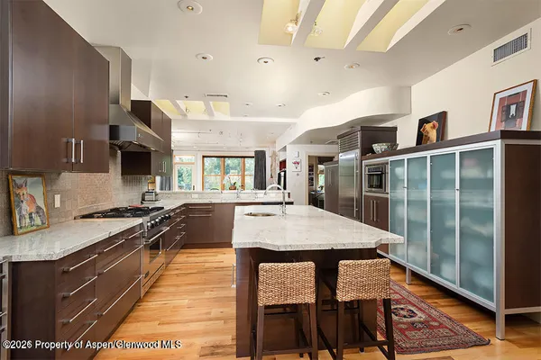 a living room with fireplace furniture and a flat screen tv