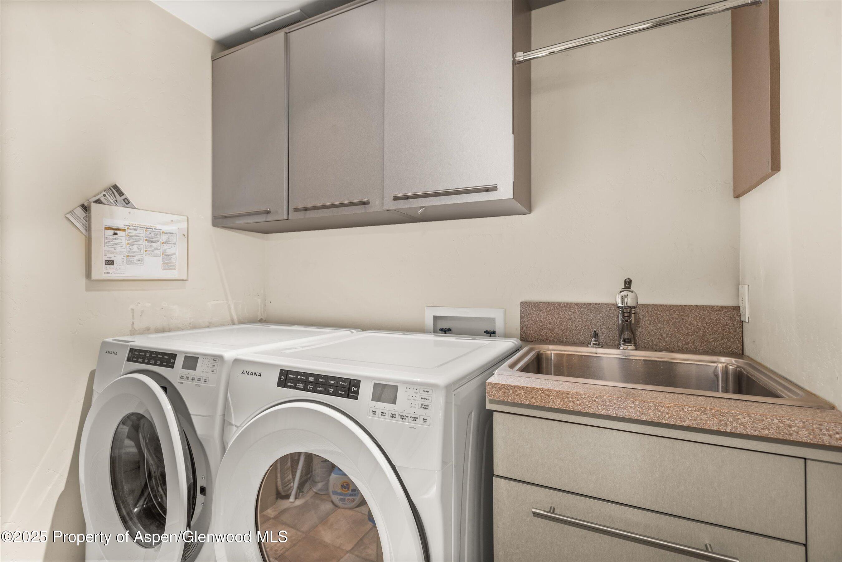 227 Midland Avenue, Unit 22 Basalt, CO 81621 - Photo 42 of 42 a utility room with dryer and washer