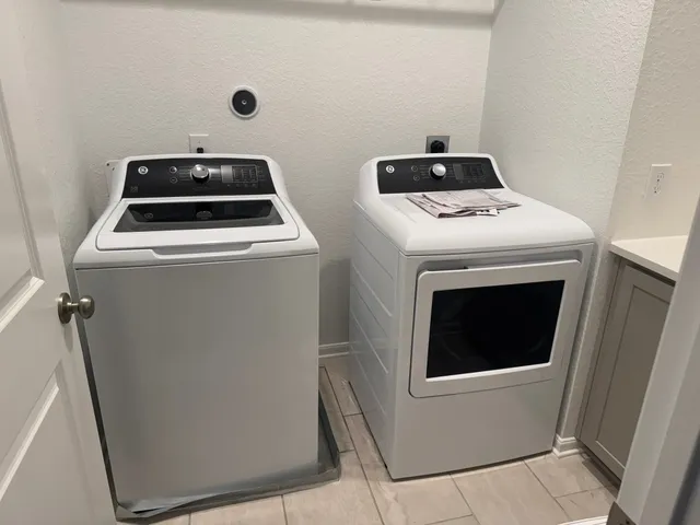 a utility room with dryer and washer