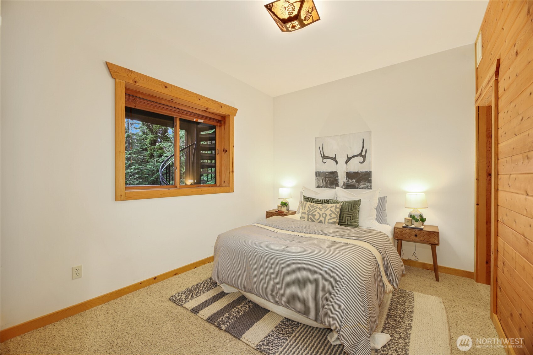 10 Rampart Way Snoqualmie Pass, WA 98068 - Photo 28 of 35 a bedroom with a bed and a painting on the wall