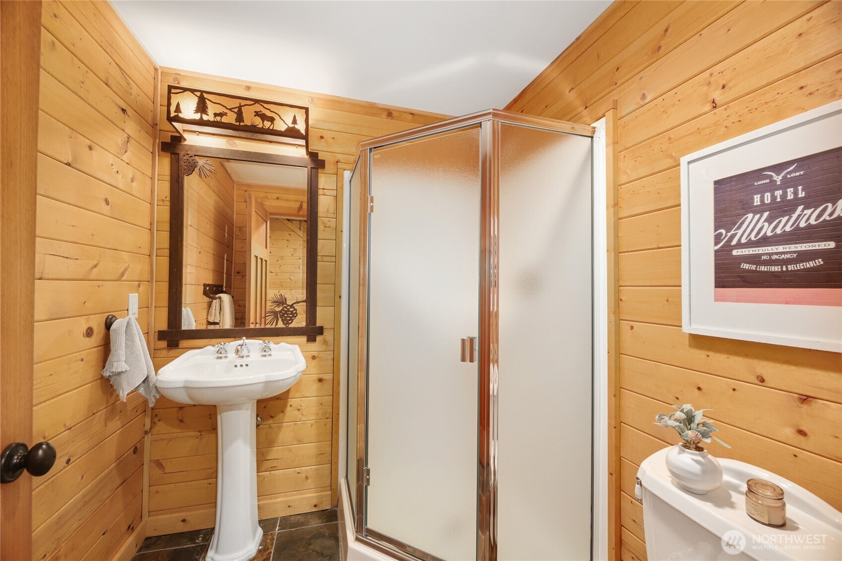 10 Rampart Way Snoqualmie Pass, WA 98068 - Photo 32 of 35 a bathroom with a sink a mirror and a shower