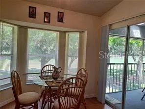 a view of a dining room with furniture window and outside view