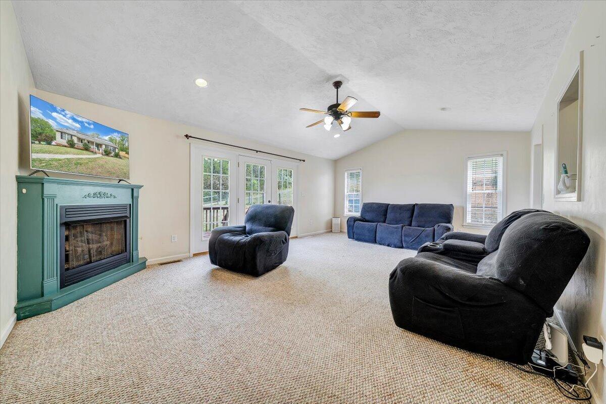 686 Pine Haven Road Fincastle, VA 24090 - Photo 16 of 56 a living room with furniture and a fireplace