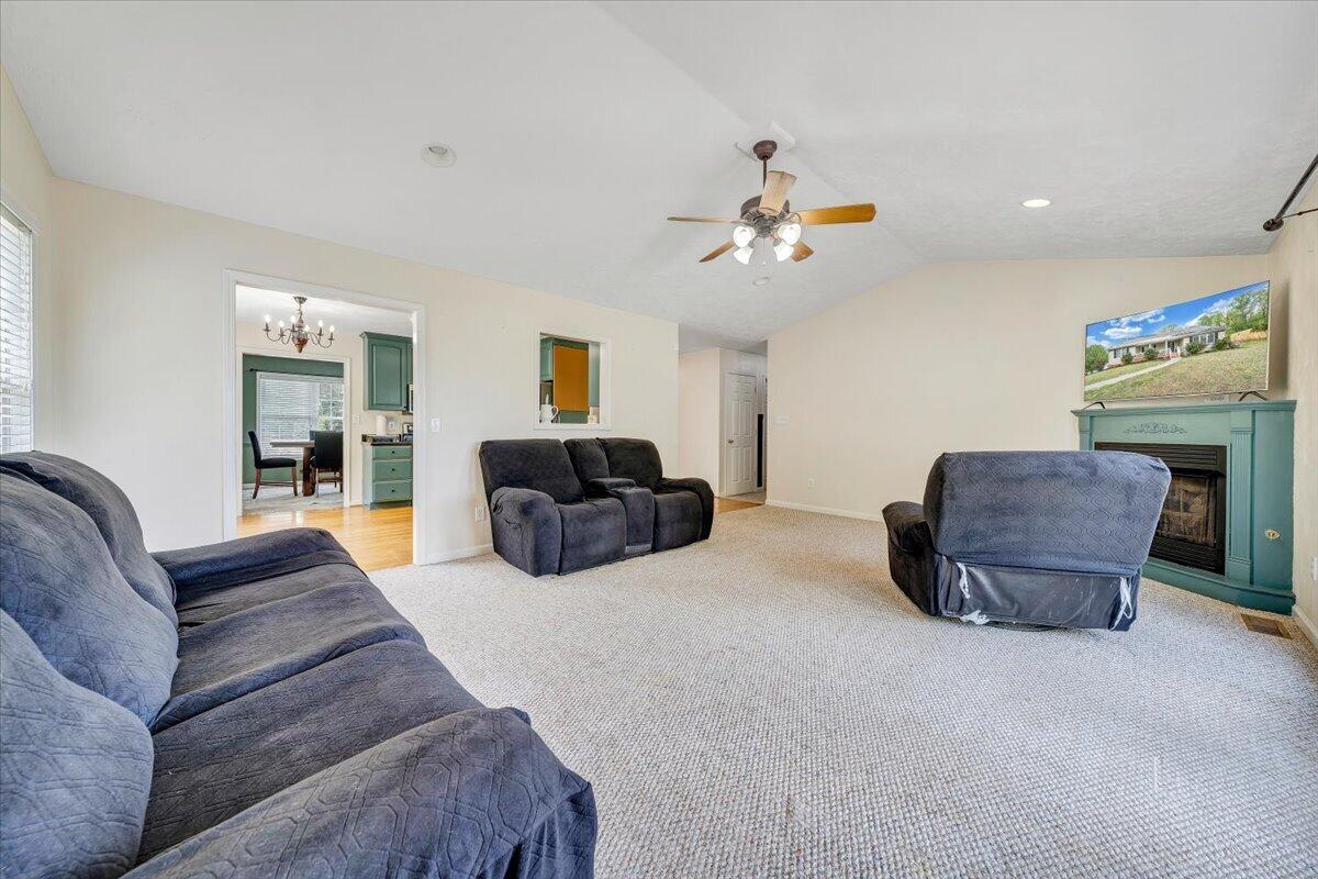 686 Pine Haven Road Fincastle, VA 24090 - Photo 18 of 56 a living room with furniture a ceiling fan and a rug