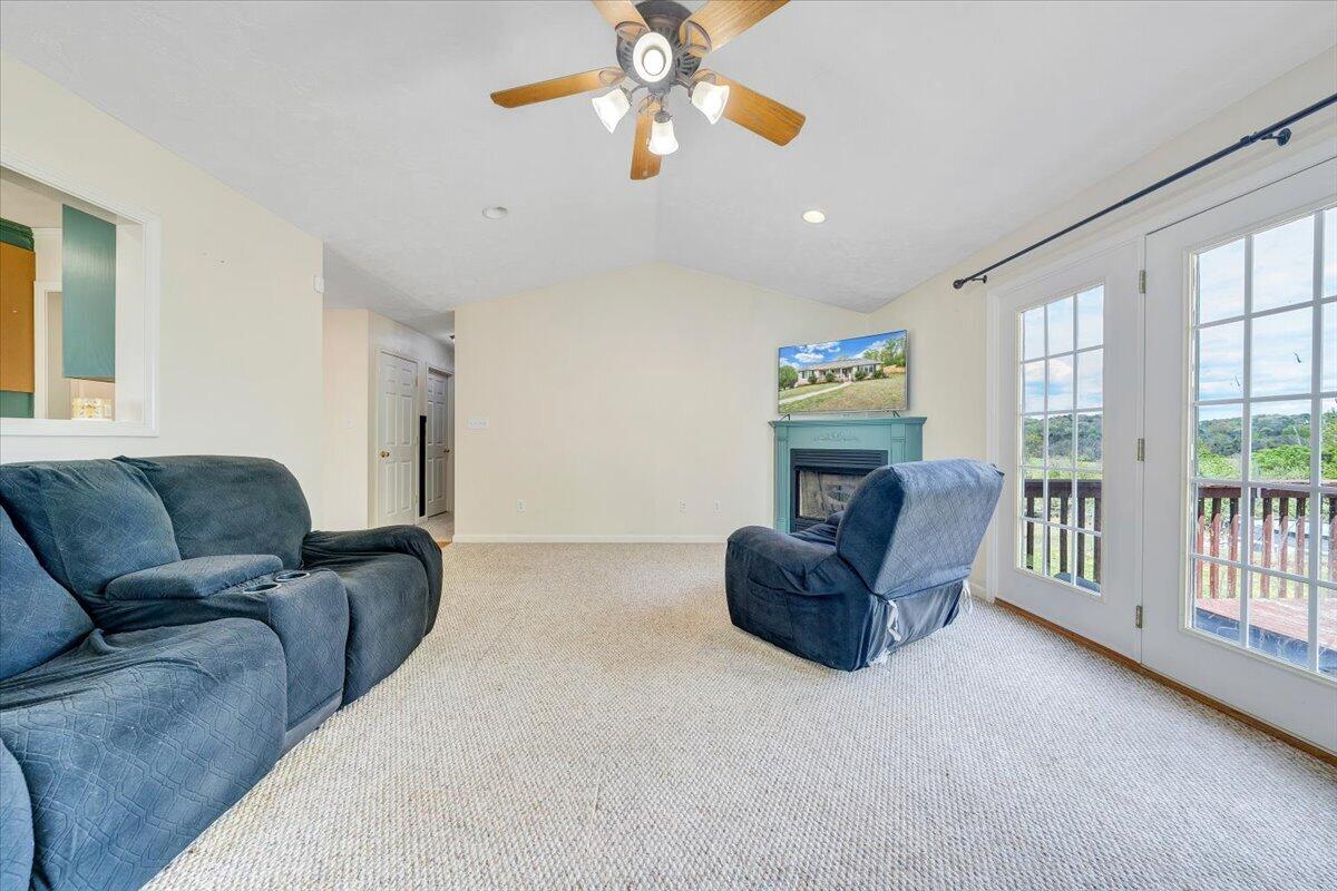 686 Pine Haven Road Fincastle, VA 24090 - Photo 19 of 56 a living room with furniture and a fireplace
