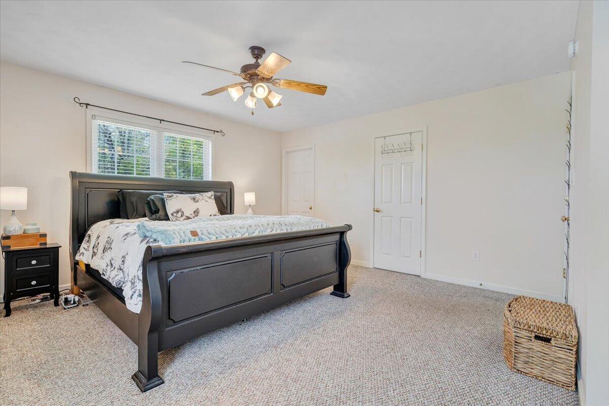 686 Pine Haven Road Fincastle, VA 24090 - Photo 25 of 56 a bed room with a bed and a chandelier