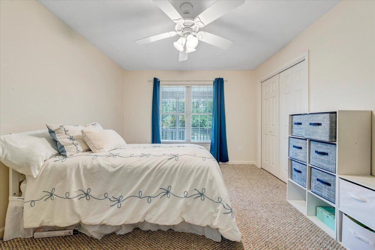 686 Pine Haven Road Fincastle, VA 24090 - Photo 30 of 56 a bedroom with a bed and a chandelier